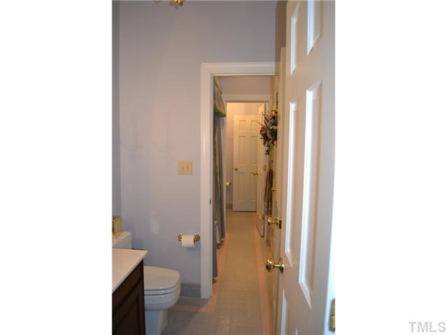 86 Dogeye Road Benson, NC 27504 - Photo 12 of 24 A jack and jill style bathroom connects two bedrooms. The Jacuzzi tub and shower combo connects two sets of sinks and toilet providing plenty of privacy.