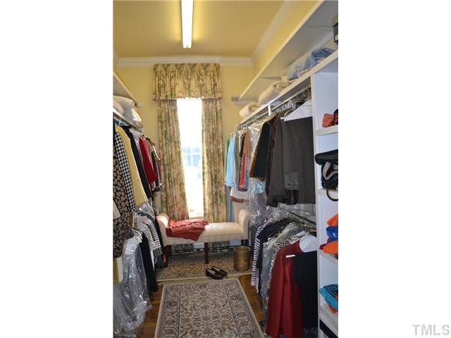 86 Dogeye Road Benson, NC 27504 - Photo 15 of 24 A large walk-in custom closet in the master bedroom has lots of storage and natural light.