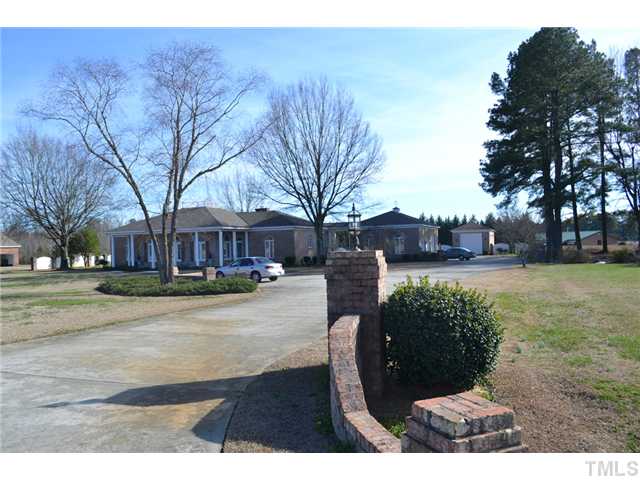 86 Dogeye Road Benson, NC 27504 - Photo 17 of 24 A long driveway leads to a 3 car garage connected to the house by a breezeway. Lots of extra parking.