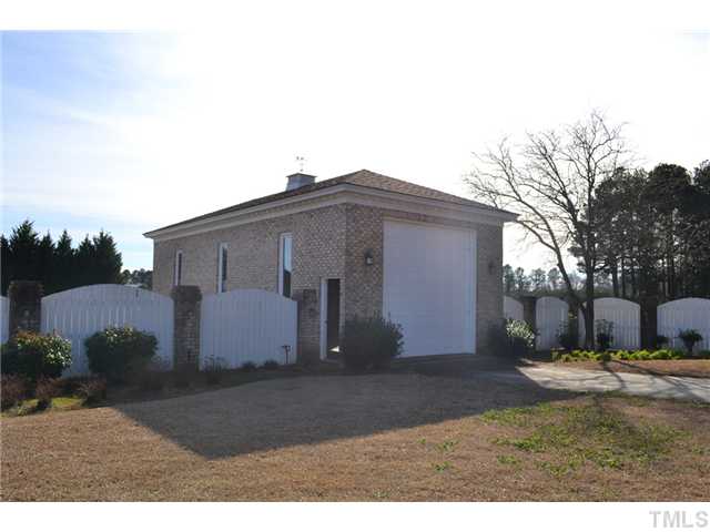 86 Dogeye Road Benson, NC 27504 - Photo 20 of 24 A separate brick garage is perfect for an RV or boat. This garage is 880 square feet, is fully finished and painted with a concrete floor.