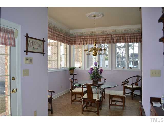 86 Dogeye Road Benson, NC 27504 - Photo 3 of 24 The breakfast nook / eat-in-kitchen is a bright and airy place thanks to the high ceilings and the Pella windows that are found throughout the entire house. All window treatments convey!