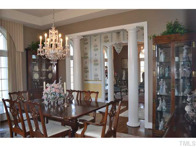 86 Dogeye Road Benson, NC 27504 - Photo 9 of 24 The formal dining room has hardwood floors, columns, trey ceiling and a gorgeous crystal chandelier. The wall paper is 100% silk and would compliment any d?cor. All rooms have an abundance of natural light!