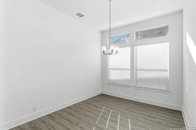 a kitchen with stainless steel appliances a sink a stove a refrigerator and cabinets