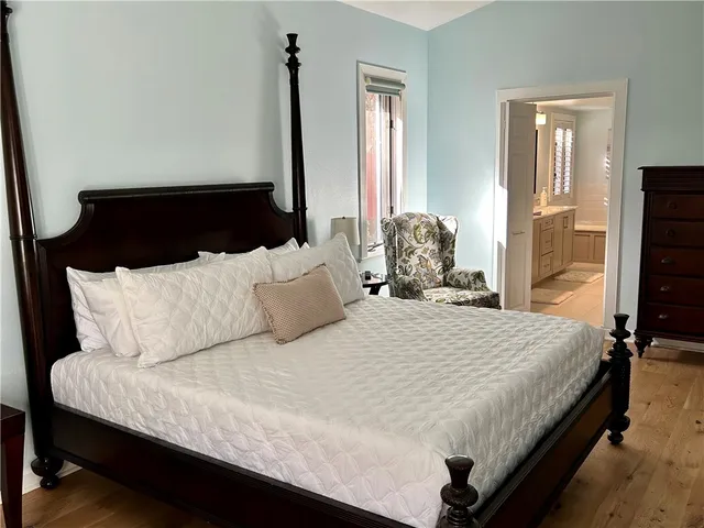 a bedroom with bed and window