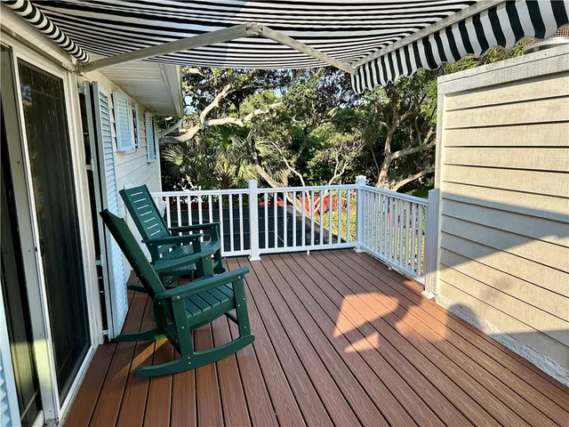 a view of outdoor space with deck and hardwood