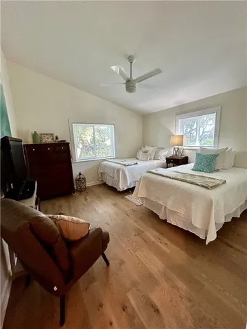 a bedroom with bed and window