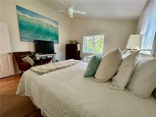 a bedroom with a bed and tv