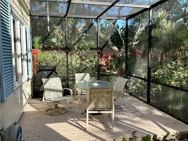 a view of balcony with chairs and table