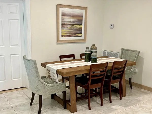 a view of a dining room with furniture