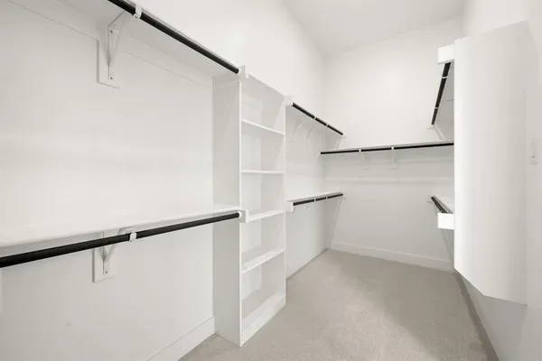 a view of an empty walk in closet
