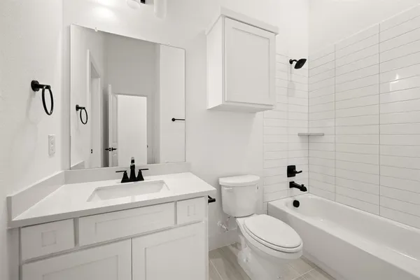 a bathroom with a sink a toilet and a bathtub