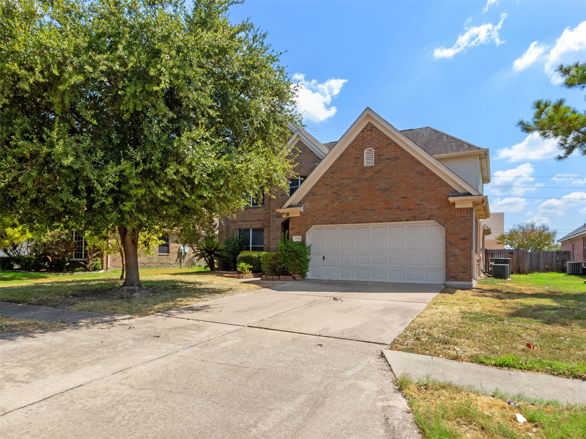 9818 Mossy Tree Lane Houston, TX 77064 - Photo 1 of 28 a front view of a house with a yard and garage