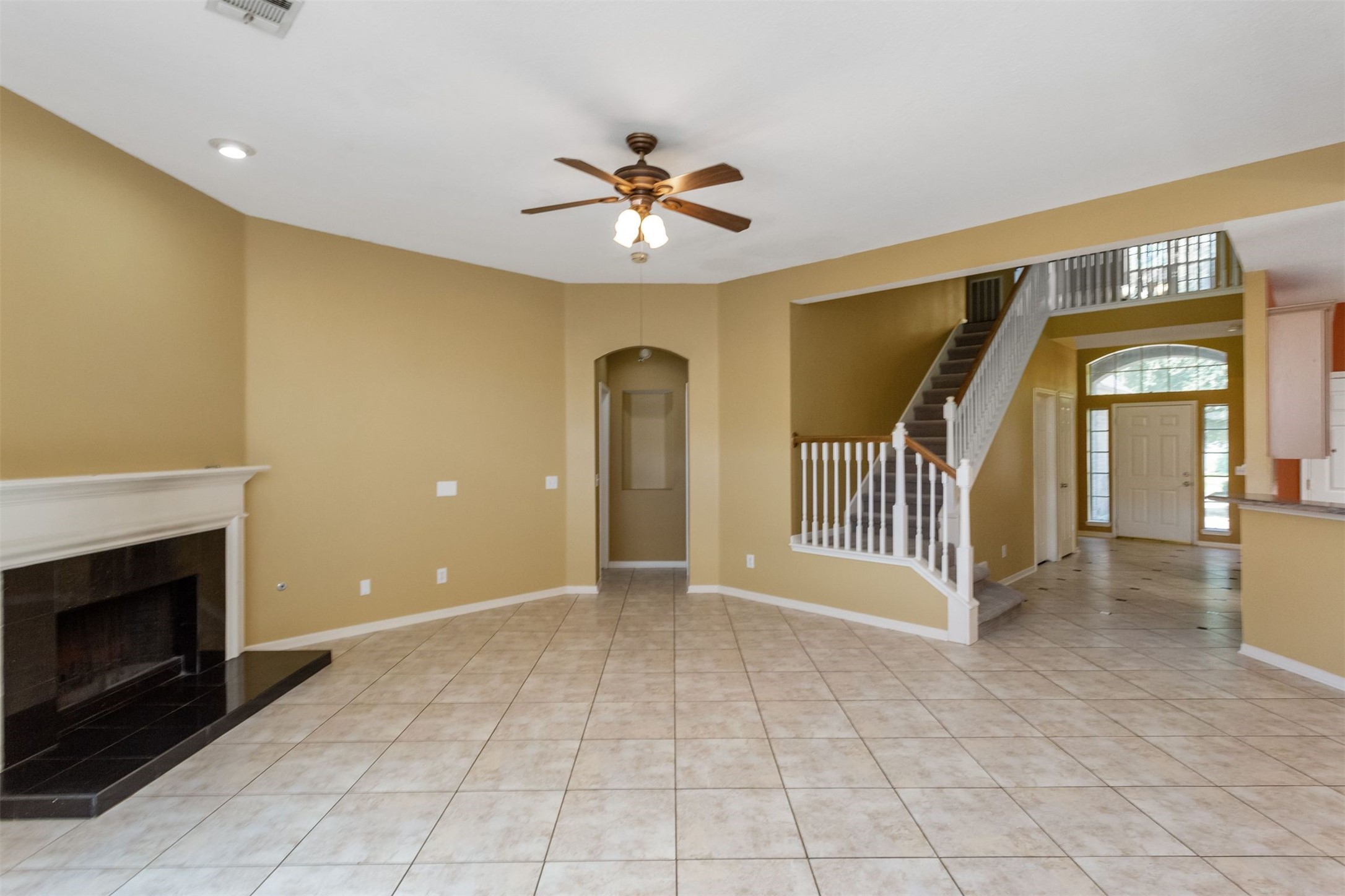 9818 Mossy Tree Lane Houston, TX 77064 - Photo 11 of 28 a view of a livingroom with a staircase