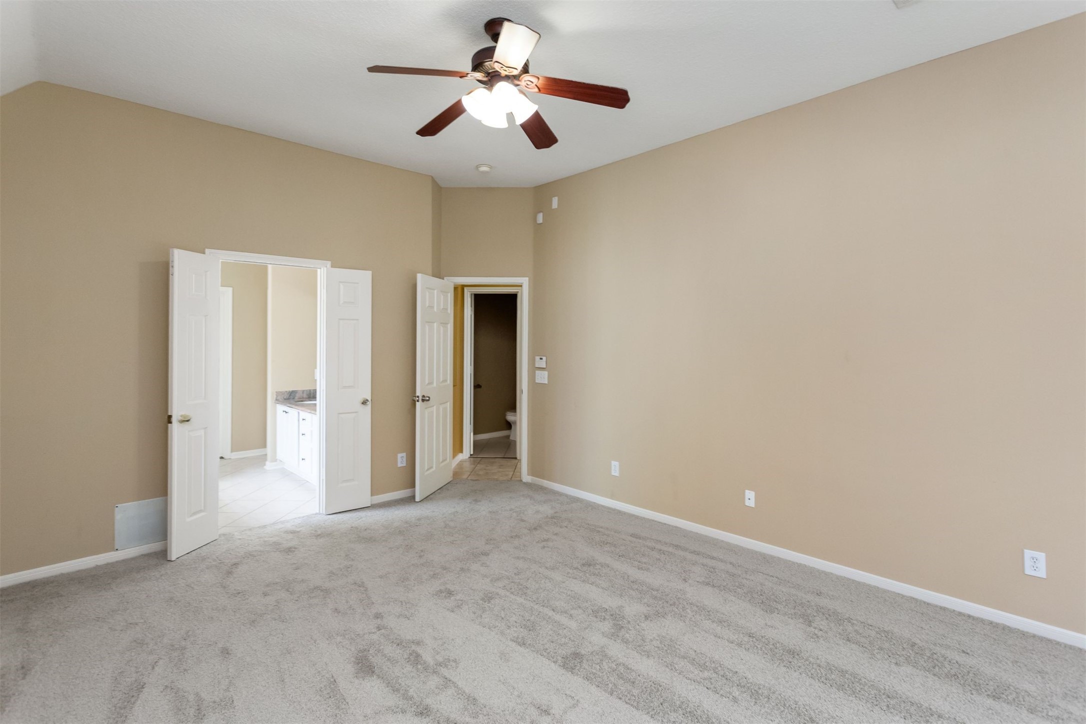 9818 Mossy Tree Lane Houston, TX 77064 - Photo 15 of 28 a view of empty room with a ceiling fan