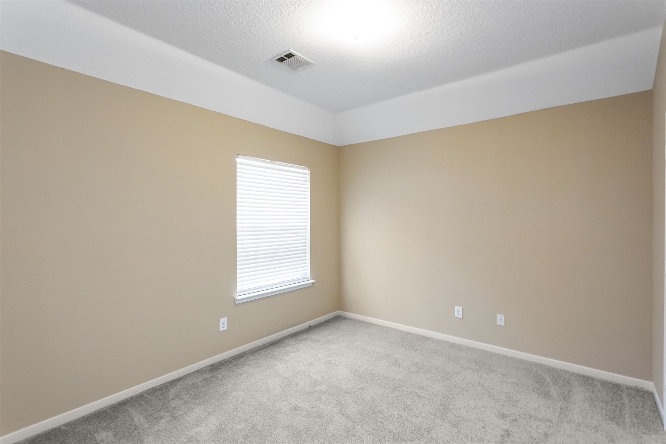 9818 Mossy Tree Lane Houston, TX 77064 - Photo 25 of 28 an empty room with a window