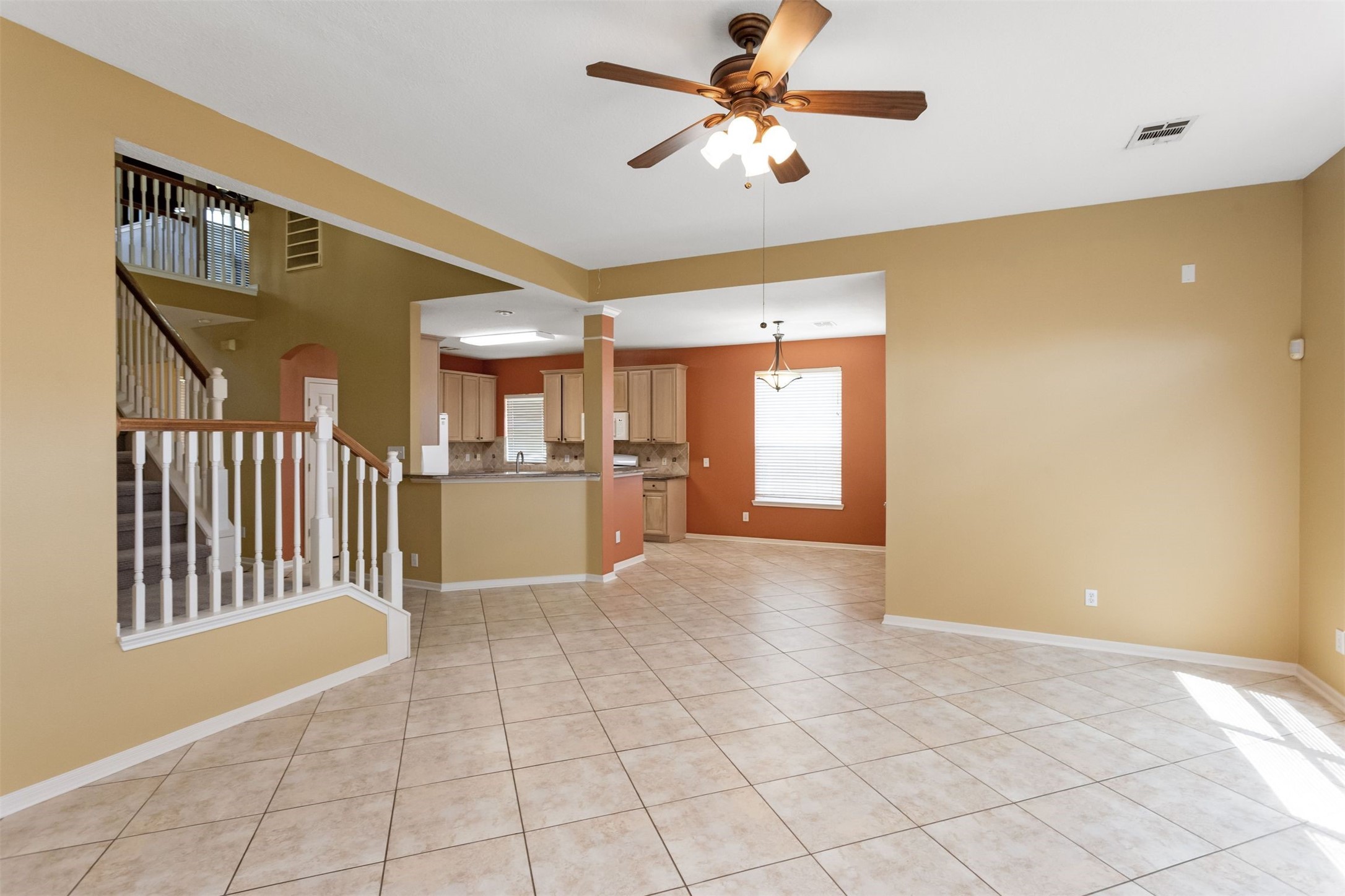 9818 Mossy Tree Lane Houston, TX 77064 - Photo 10 of 28 a view of an empty room with a kitchen
