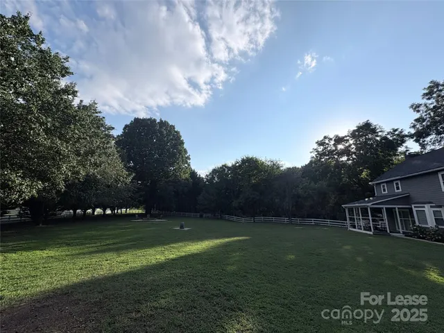 a view of a house with a big yard