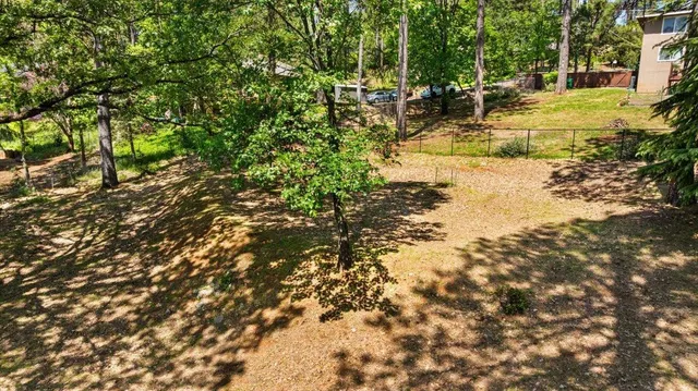 a view of a yard with swimming pool