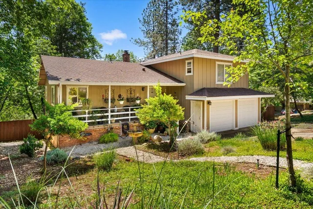 a house view with a garden space