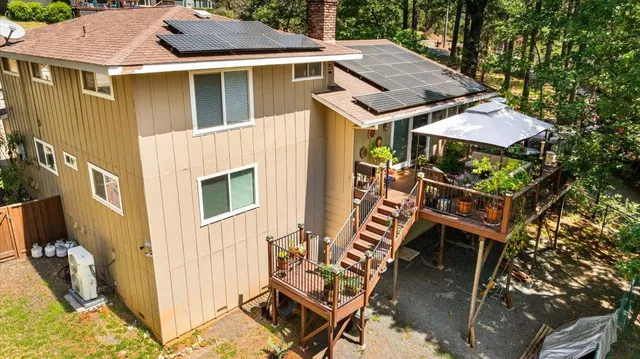 a aerial view of a house with table and chairs