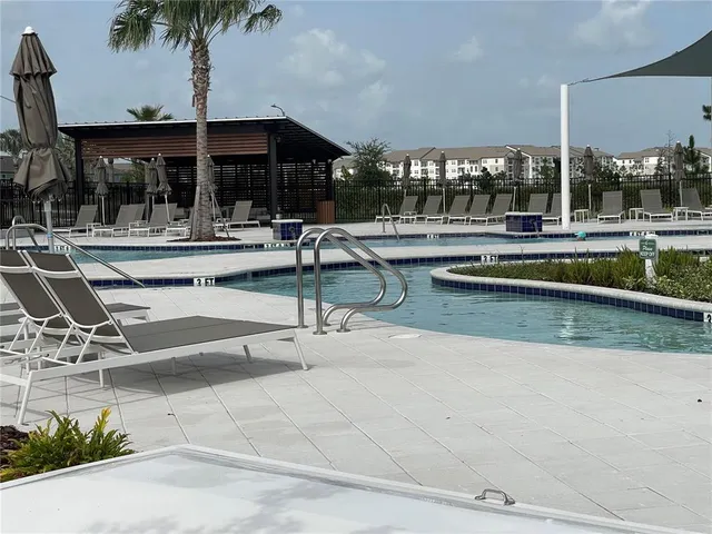 a view of a swimming pool with a patio