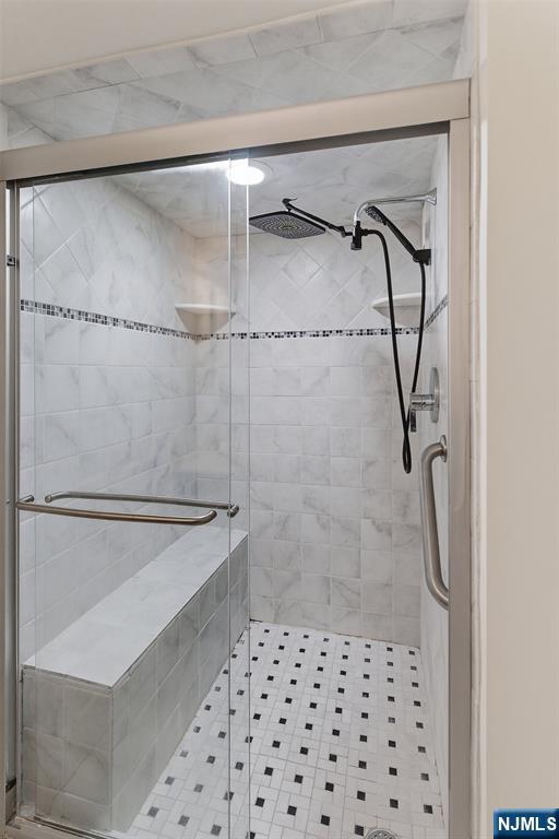 301 Beech Street, Unit 9K Hackensack, NJ 07601 - Photo 16 of 24 a bathroom with a shower