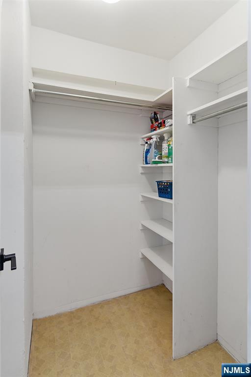 301 Beech Street, Unit 9K Hackensack, NJ 07601 - Photo 17 of 24 a view of an empty walk in closet