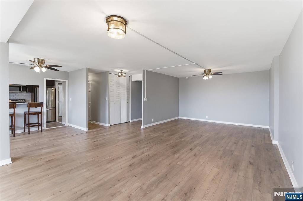 301 Beech Street, Unit 9K Hackensack, NJ 07601 - Photo 8 of 24 a view of empty room with wooden floor