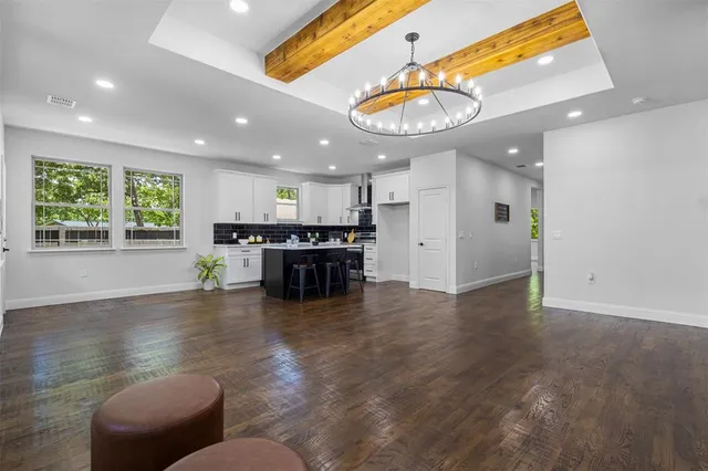 a view of kitchen and dining room with wooden floor