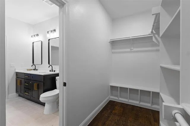 a bathroom with a sink double vanity and a mirror