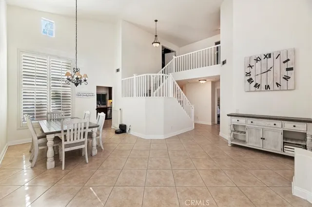 a view of kitchen with furniture and windows