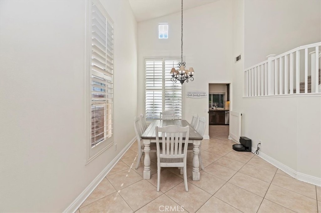 1040 Nighthawk Circle Corona, CA 92881 - Photo 14 of 39 a dining room with furniture and a window