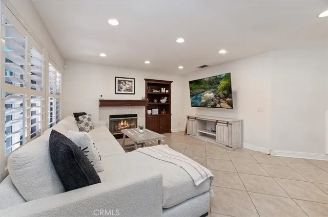 a large bedroom with a bed and a flat screen tv