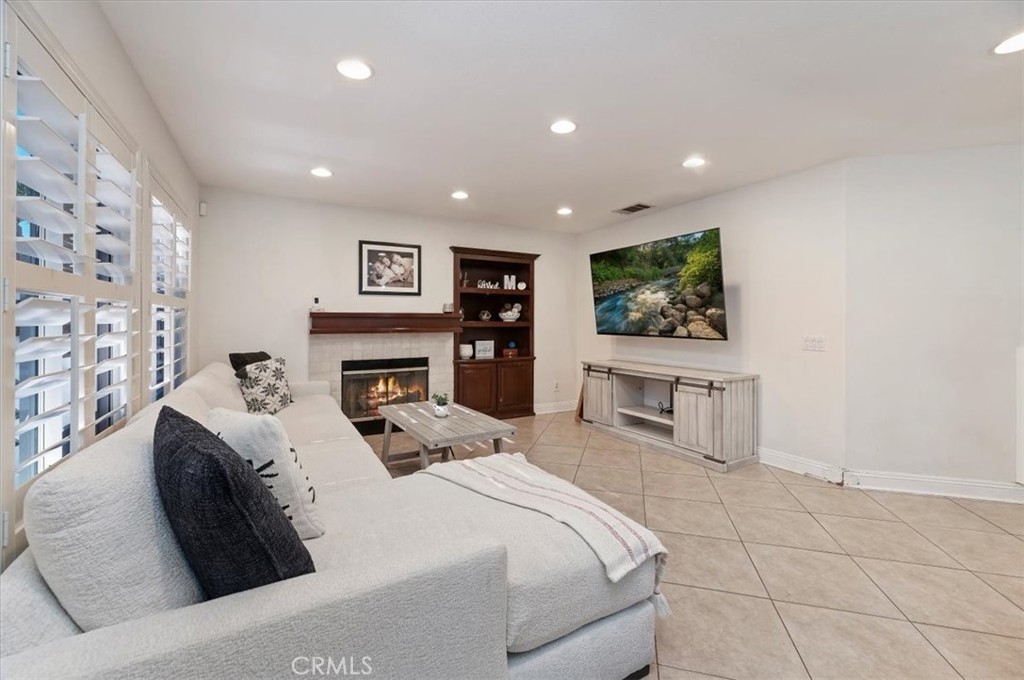 1040 Nighthawk Circle Corona, CA 92881 - Photo 16 of 39 a large bedroom with a bed and a flat screen tv