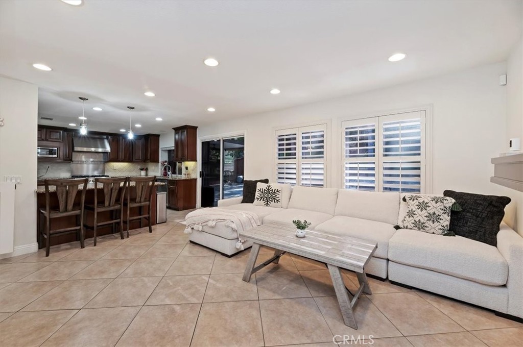 1040 Nighthawk Circle Corona, CA 92881 - Photo 17 of 39 a living room with furniture and kitchen view