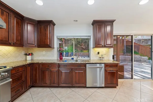 a kitchen with a sink and a stove
