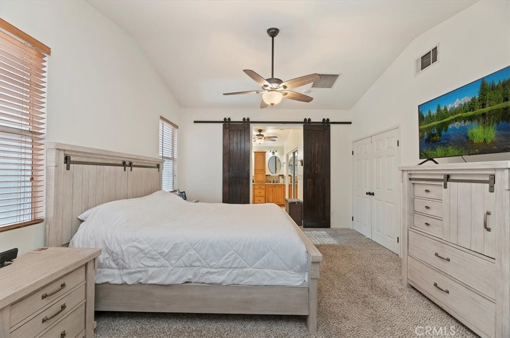 1040 Nighthawk Circle Corona, CA 92881 - Photo 29 of 39 a bedroom with a bed and a flat screen tv