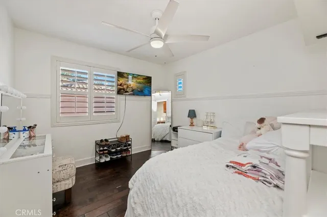 a bathroom with a granite countertop toilet and a sink