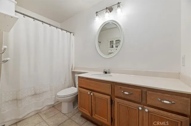 a bedroom with a bed and a desk