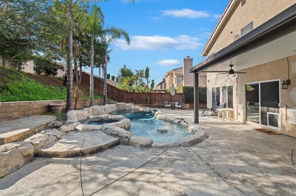 1040 Nighthawk Circle Corona, CA 92881 - Photo 38 of 39 a view of a patio with swimming pool table and chairs