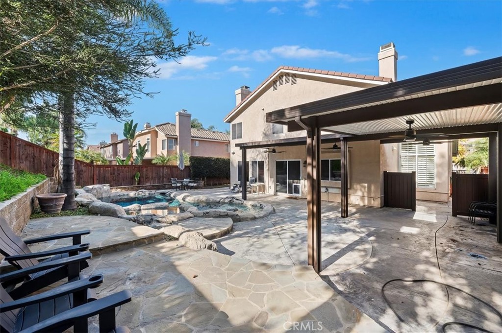 1040 Nighthawk Circle Corona, CA 92881 - Photo 39 of 39 a view of a patio with swimming pool table and chairs