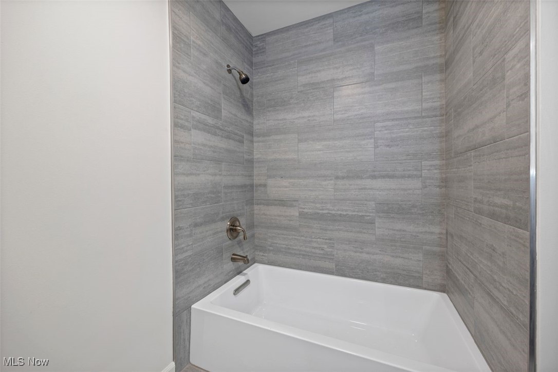 1515 Butler Road New London, OH 44851 - Photo 25 of 39 Bathroom featuring washtub / shower combination