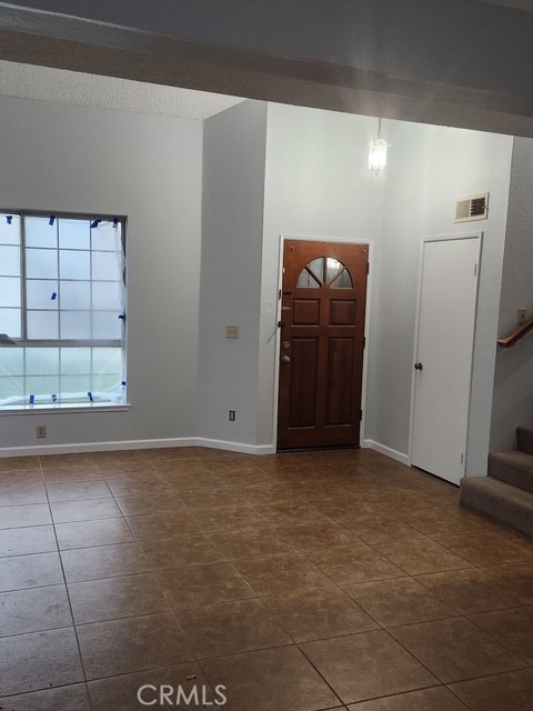 438 Sherwood Place Tehachapi, CA 93561 - Photo 4 of 5 a view of an empty room with a window