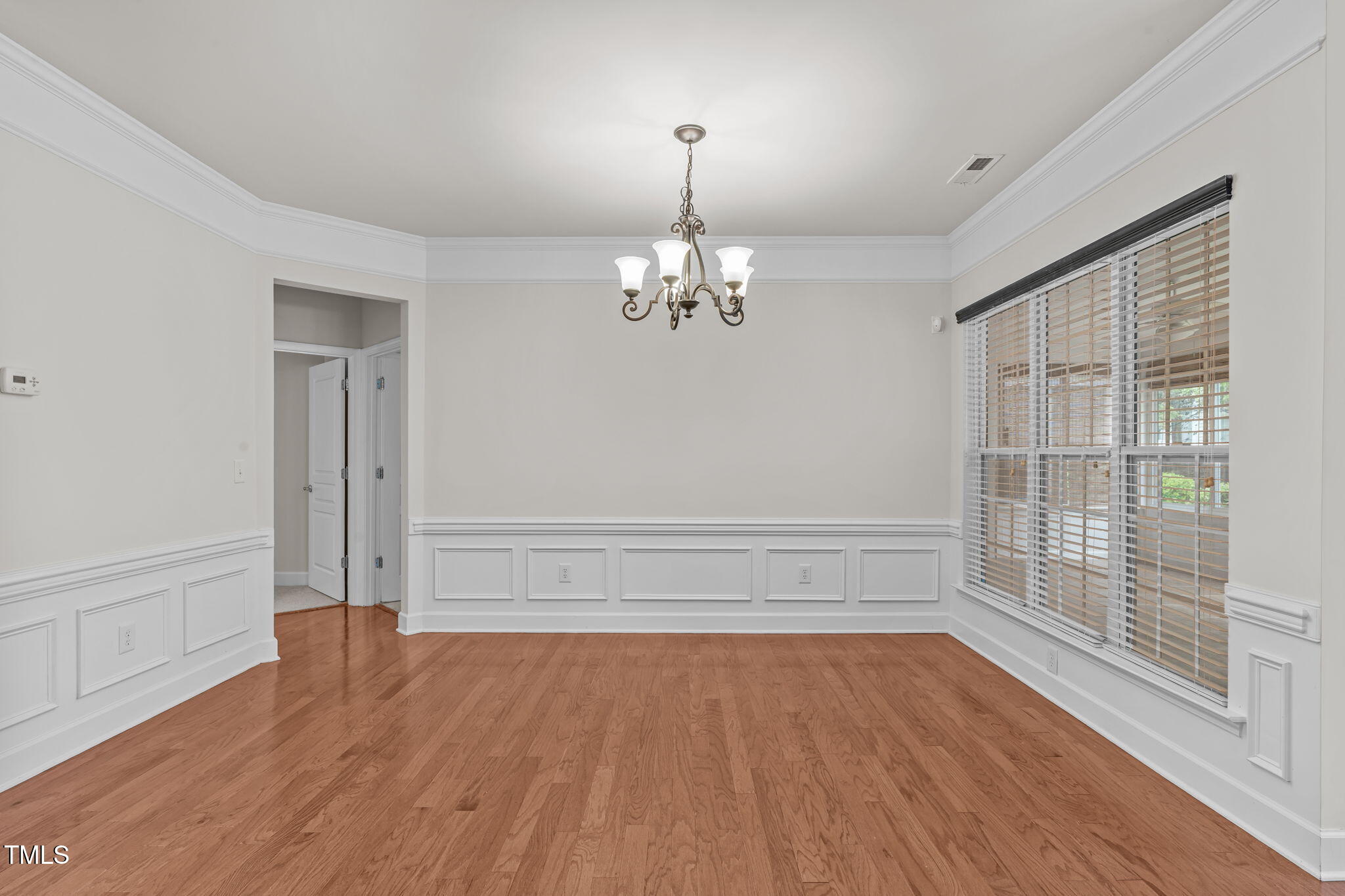 208 Beckingham Loop Cary, NC 27519 - Photo 12 of 47 a view of wooden floor and windows in a room