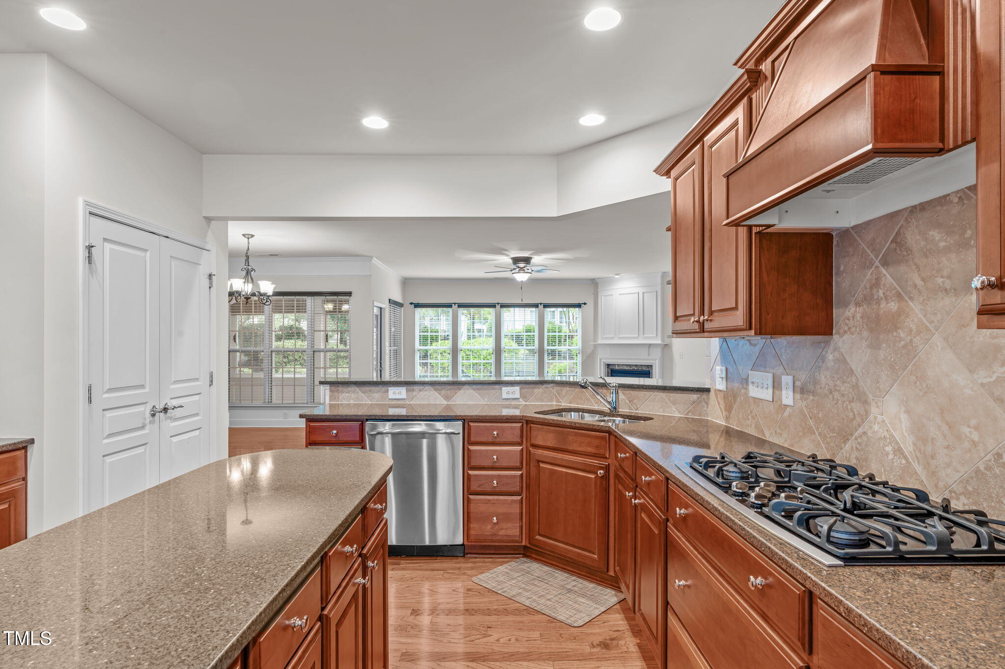 208 Beckingham Loop Cary, NC 27519 - Photo 17 of 47 a kitchen with stainless steel appliances granite countertop a sink stove and refrigerator