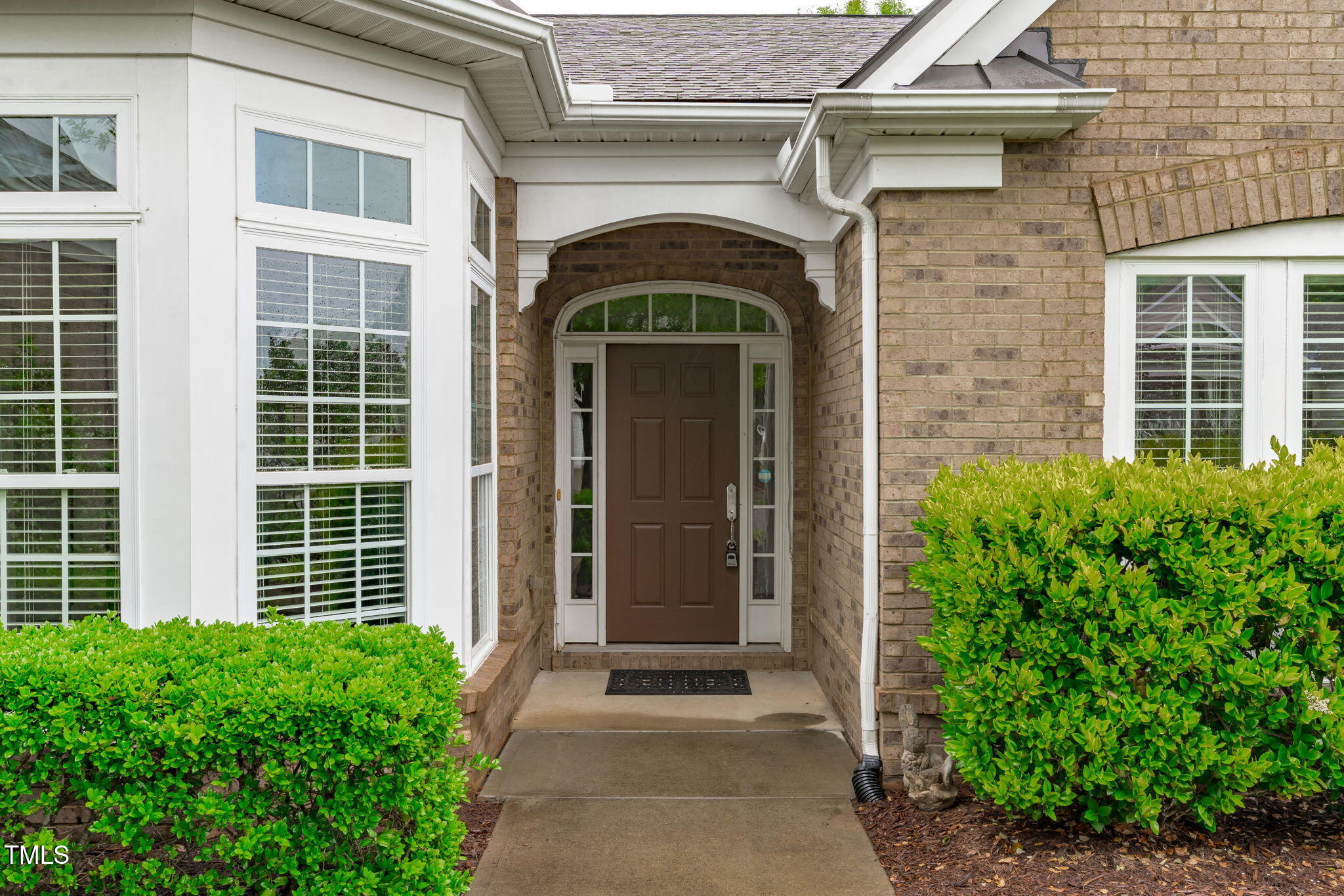 208 Beckingham Loop Cary, NC 27519 - Photo 2 of 47 a front view of a house with a door and windows