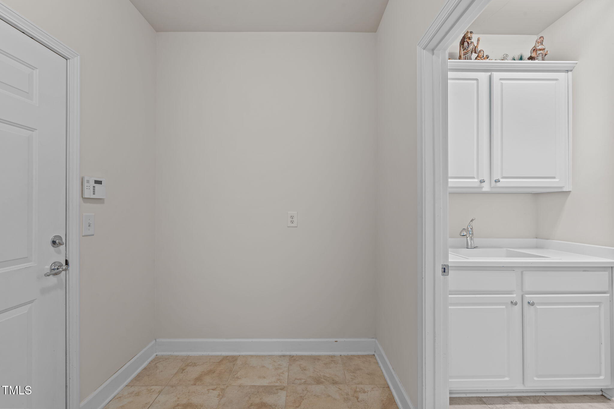 208 Beckingham Loop Cary, NC 27519 - Photo 21 of 47 a bathroom with a sink and cabinets
