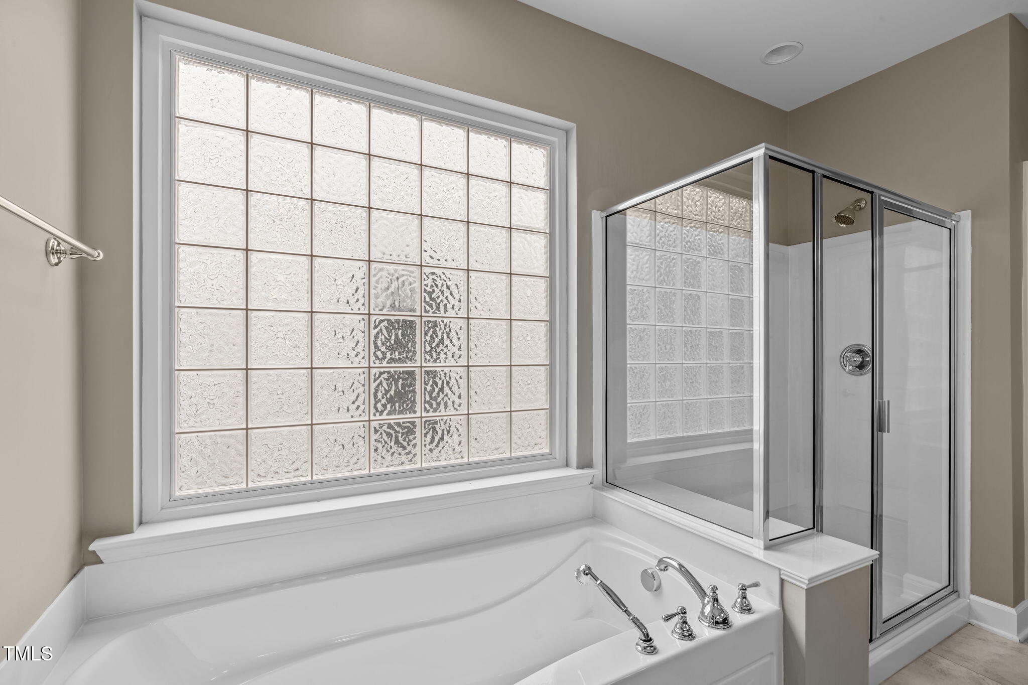 208 Beckingham Loop Cary, NC 27519 - Photo 28 of 47 a bathroom with a bathtub and a shower