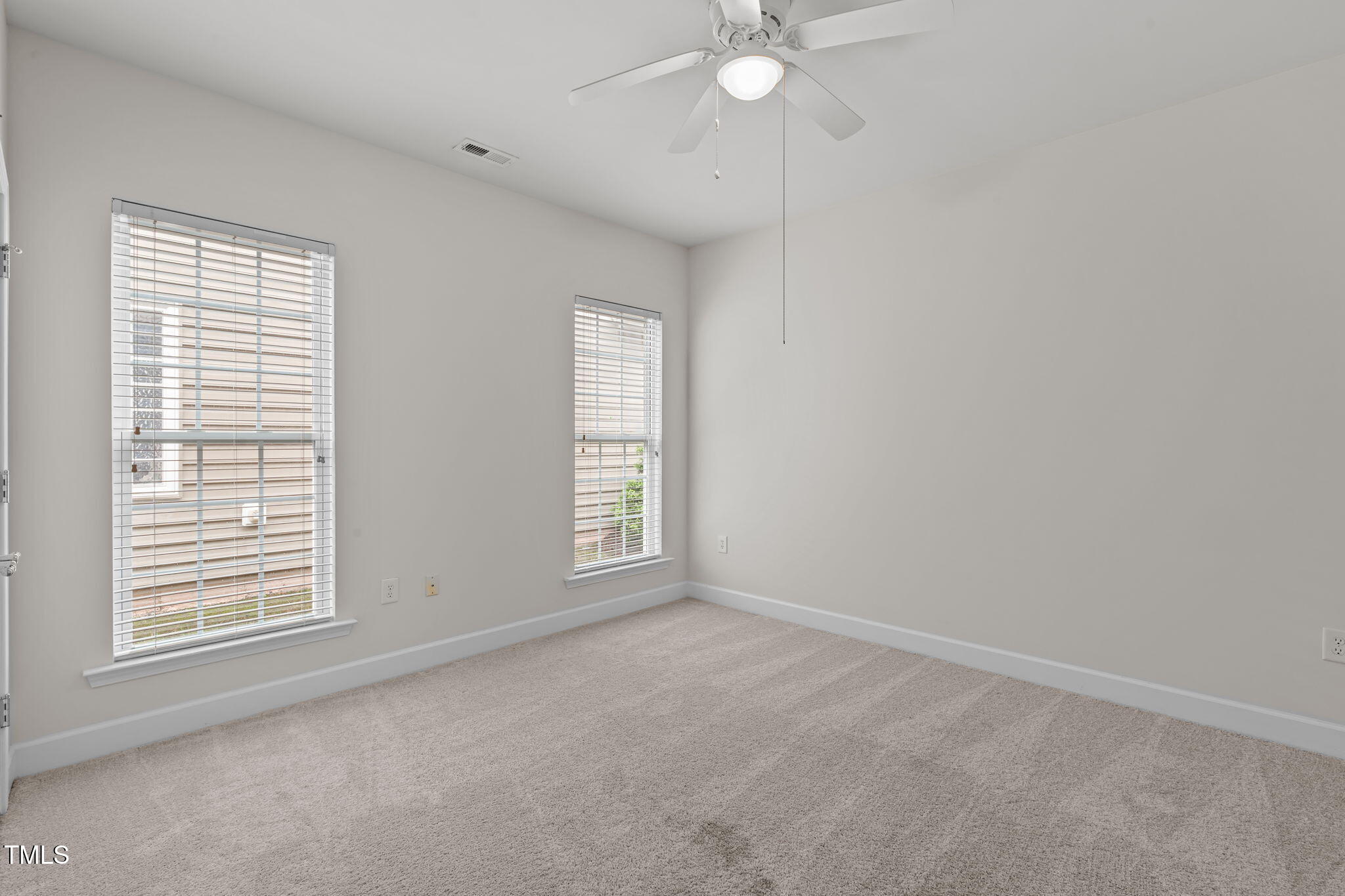208 Beckingham Loop Cary, NC 27519 - Photo 30 of 47 an empty room with windows and fan