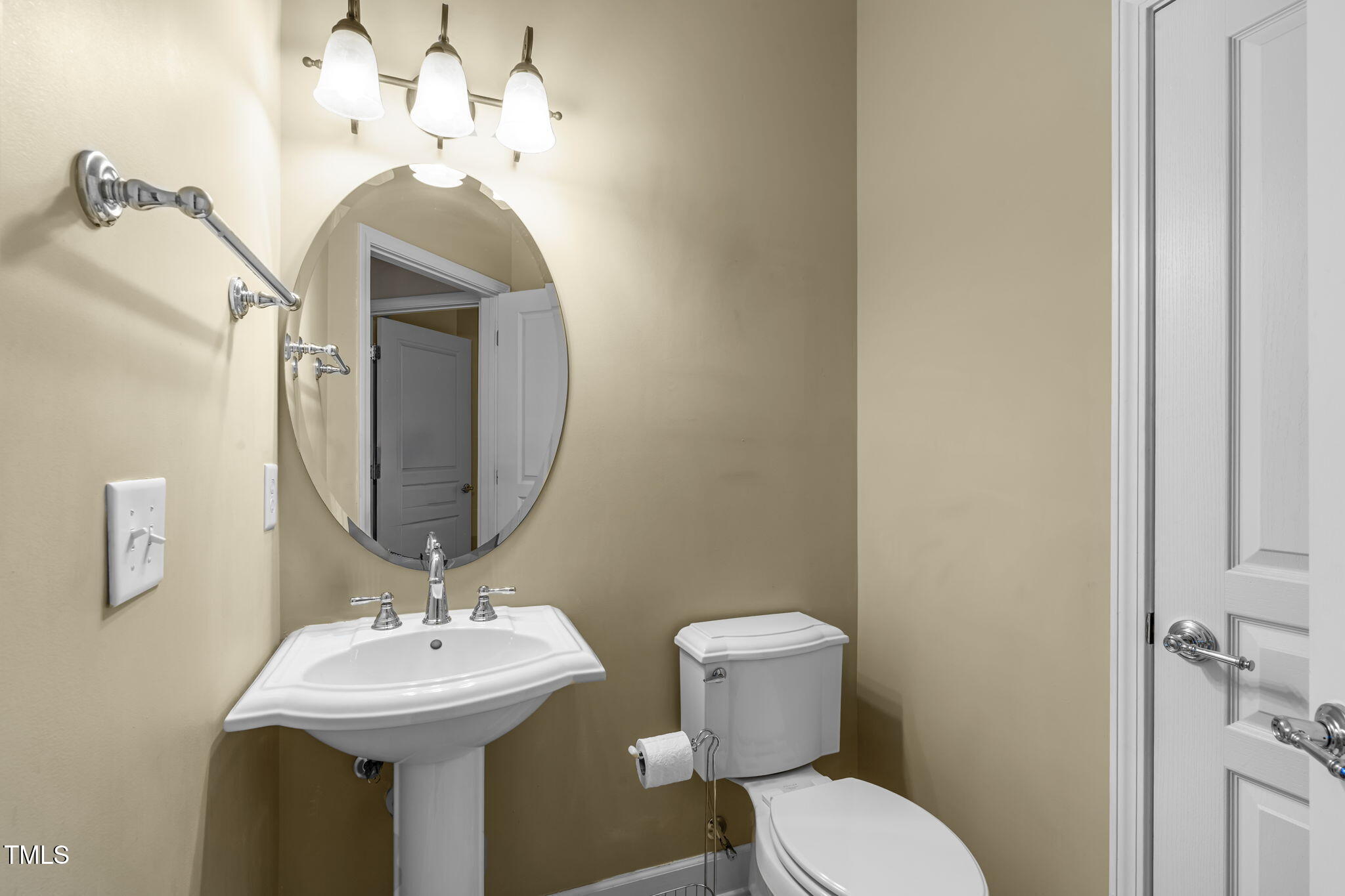 208 Beckingham Loop Cary, NC 27519 - Photo 32 of 47 a bathroom with a toilet sink and mirror